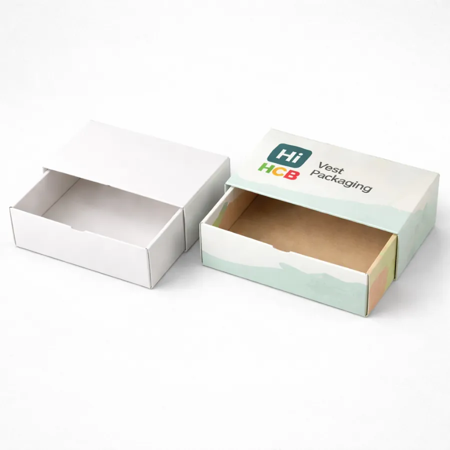 Two drawer-style slide boxes- featuring a white outer sleeve and a brown kraft internal tray- class=